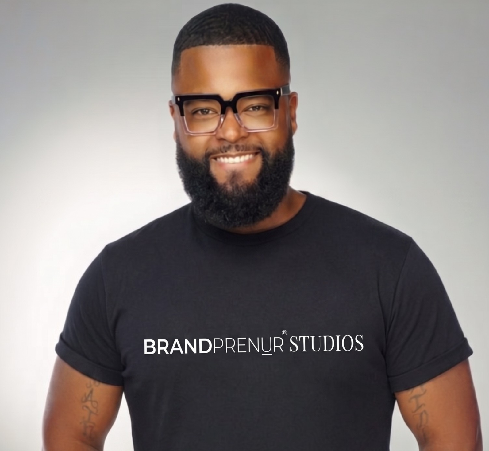 Victor Coker, Chief Training Officer at Brandprenuer Studios, wearing a Brandprenuer Studios branded tee.